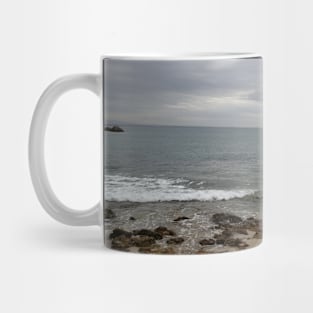 View from a sandy beach of a boat at sea Mug
